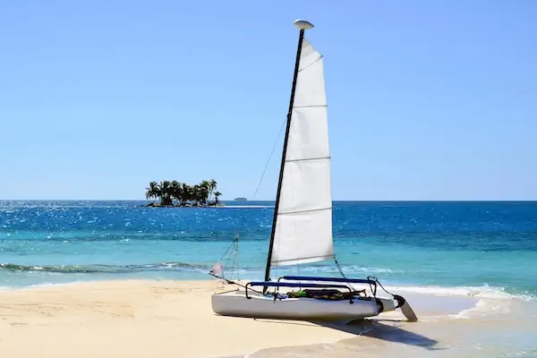 Cayes, Belize A small sailing boat is on a small caye in the Caribbean Ocean of Belize