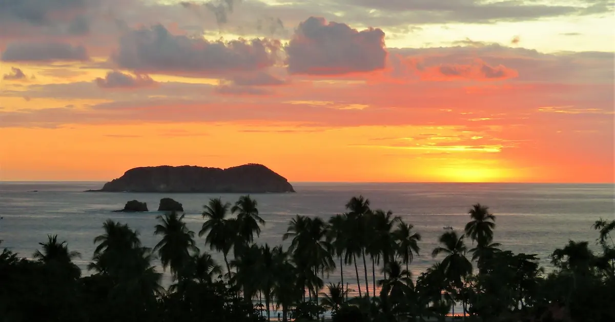 The sunset and orange color in the sky in the beach of Manuel Antonio