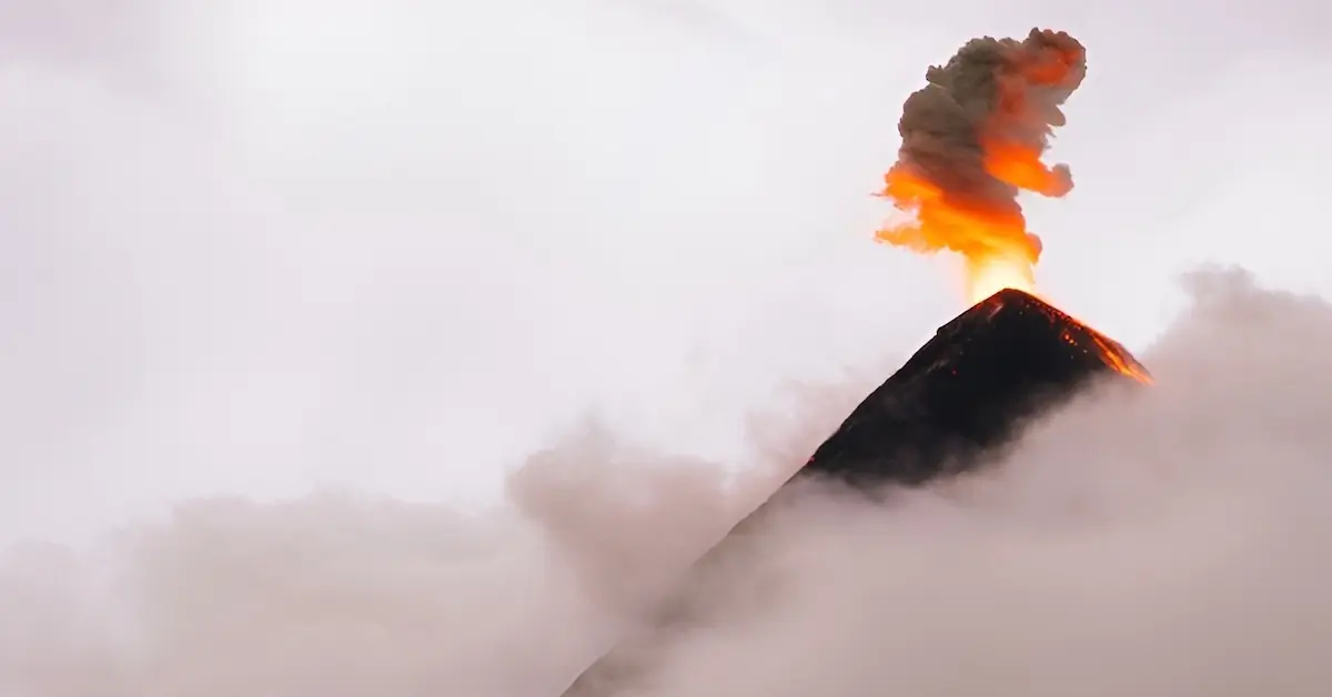 An eruption of Volcano de Fuego is seeing above the clouds