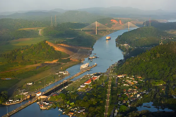 An aerial view of the Panama Canal and its surrounding mountains