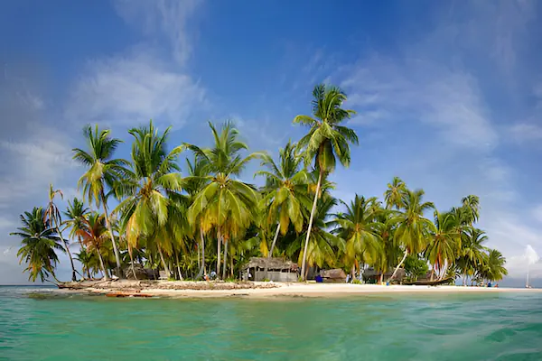 A small tropical island in San Blas full with palm trees