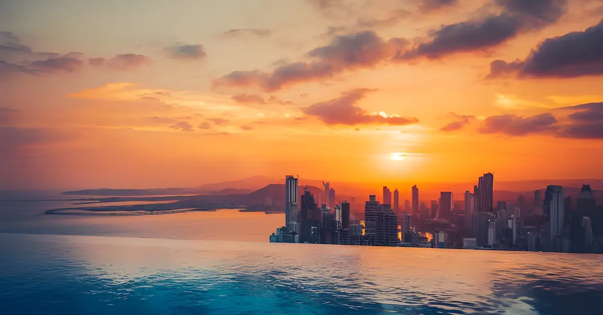 The skyline of Panama City during sunset seeing from an infinity pool