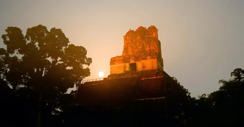 The sunrise in the back of Temple II in Tikal
