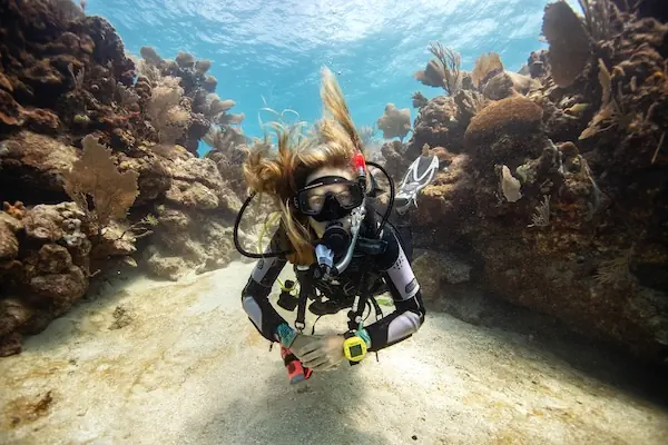 A diver is in the barrier reef in the Caribbean Ocean close to Utila Island