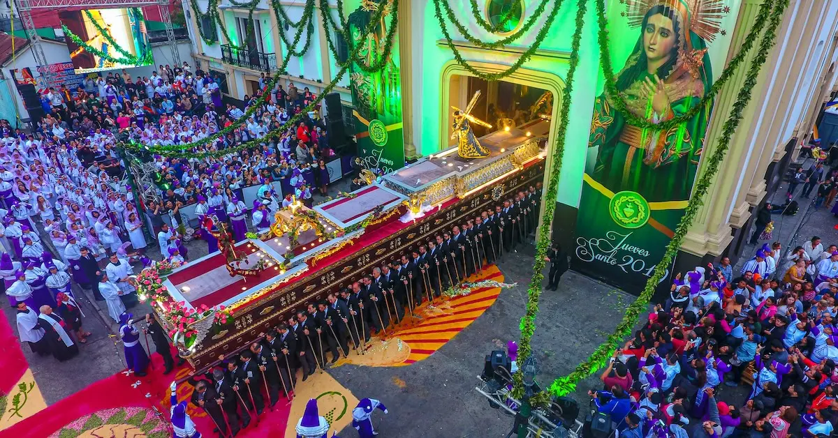 Aerial view of the Jesús de Candelaria procession departing Candelaria Church in Guatemala on Holy Thursday 2019, surrounded by devotees.